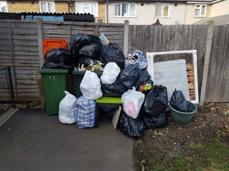 Team members conducting a site assessment for skip placement in a street